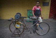 Knife sharpener on his bike