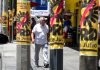 A man walks by PRD campaign posters on posts in Mexico City