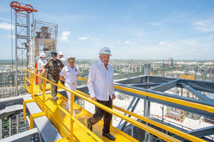 dos bocas President López Obrador tours the refinery as part of Friday's inaugural events.