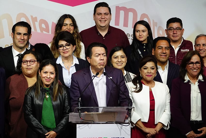 A group of politicians at a podium