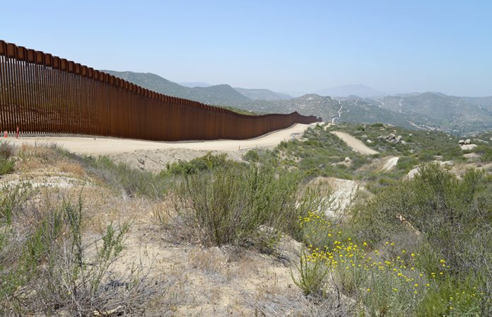 greg-bulla-f0j_le95Ffc-unsplash850 A stretch of the Mexico-US border wall in the desert