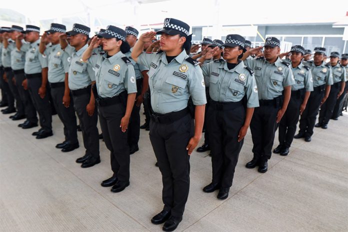National Guard members salute during the inauguration of new facilities in Oaxaca on Sunday.