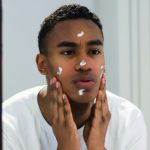 Man applying skincare cream