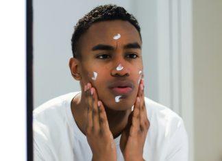 Man applying skincare cream