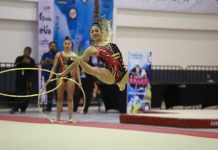 Mexican Olympic team member of the rhythmic gymnastic team performing with hoops