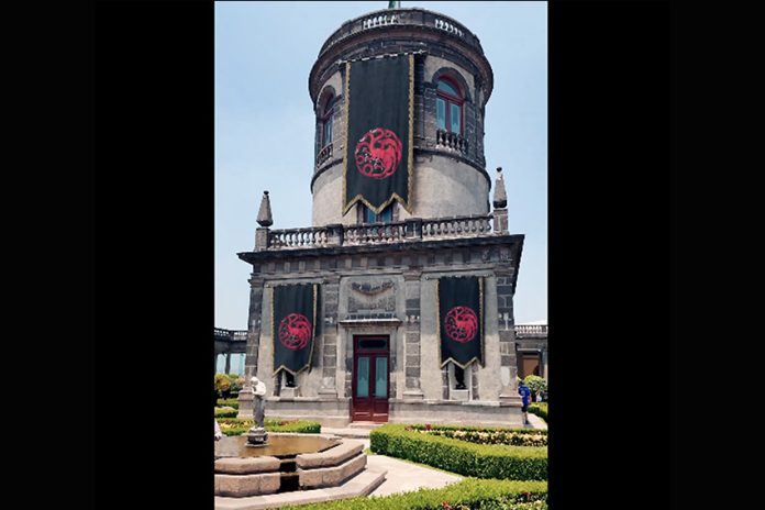 Screenshot from Max ad Part of Chapultepec Castle with what looks like three black and red banners hanging from it