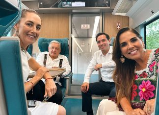 Claudia Sheinbaum, AMLO and Mara Lezama sit in a car of the Maya Train.
