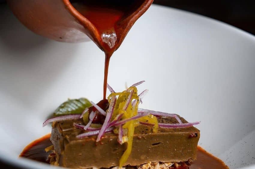 Tamale with Mixe meat and yellow mole with Pitiona.