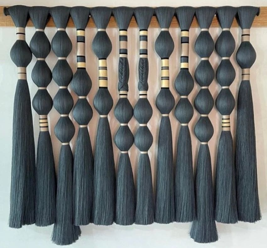 Resembling hanging sculptures, evoke abstract art and blur the lines between sculpture, painting, and impeccable craftsmanship.